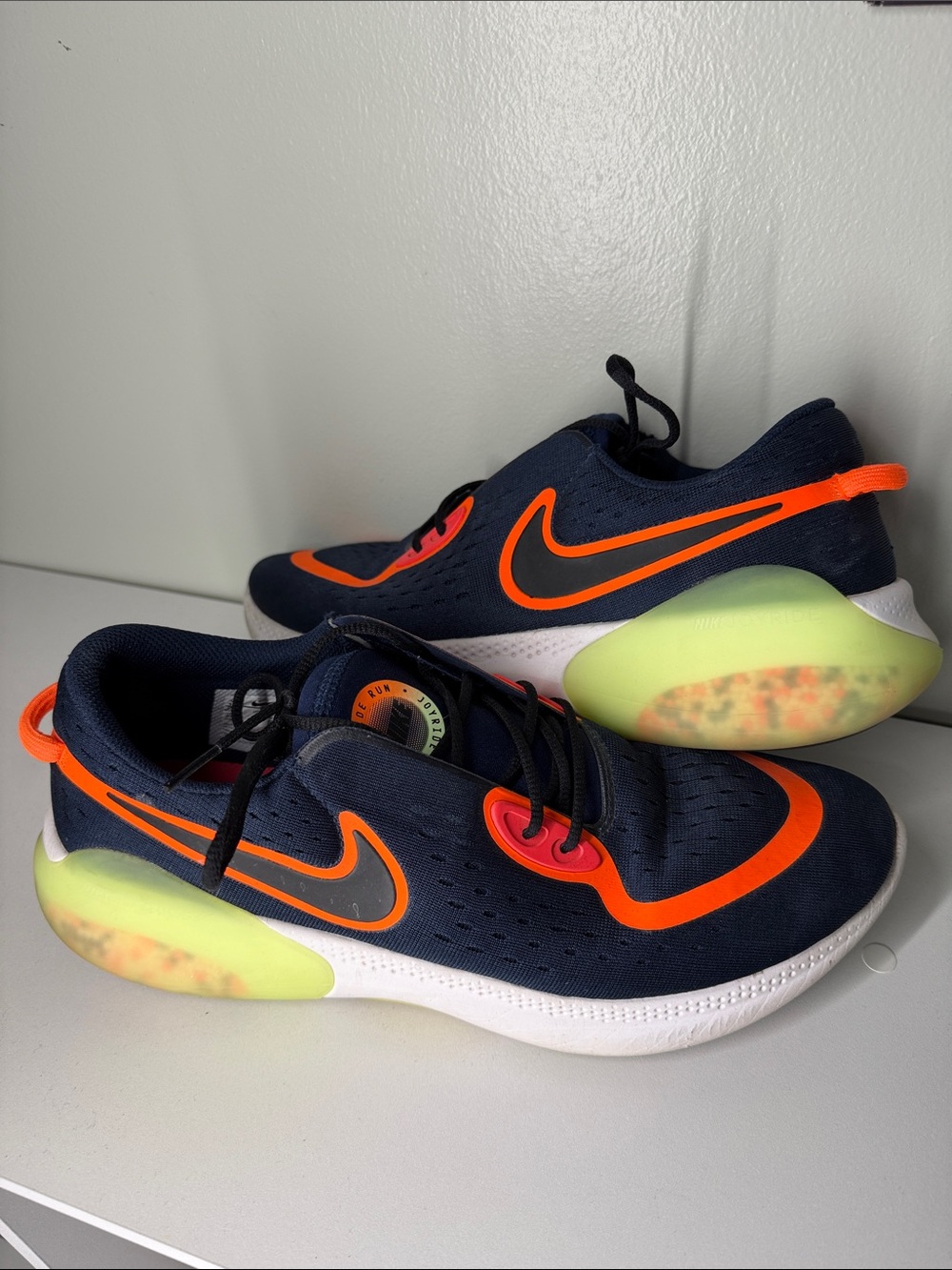 Nike Joyride Navy Athletic Sneakers with Orange Swoosh and Neon Green Pods